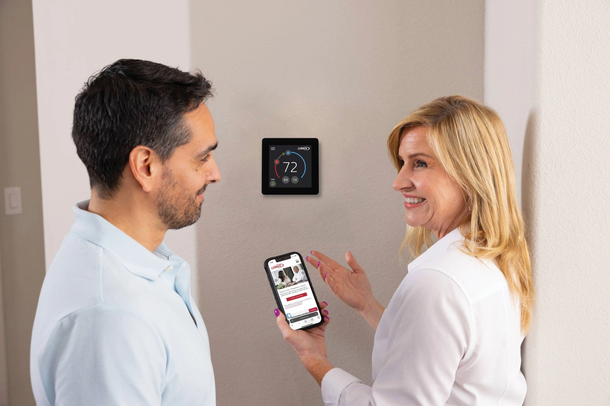two people using lennox smart thermostat  